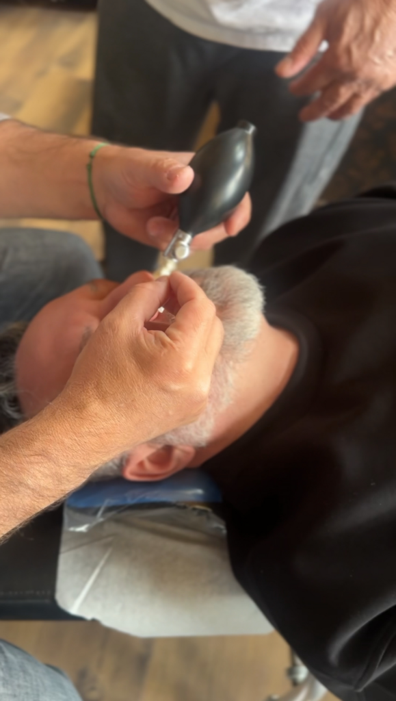 Close-up of Cranial Facial Release balloon insertion treatment performed in Missoula Montana at Electric Rehab & Fitness.