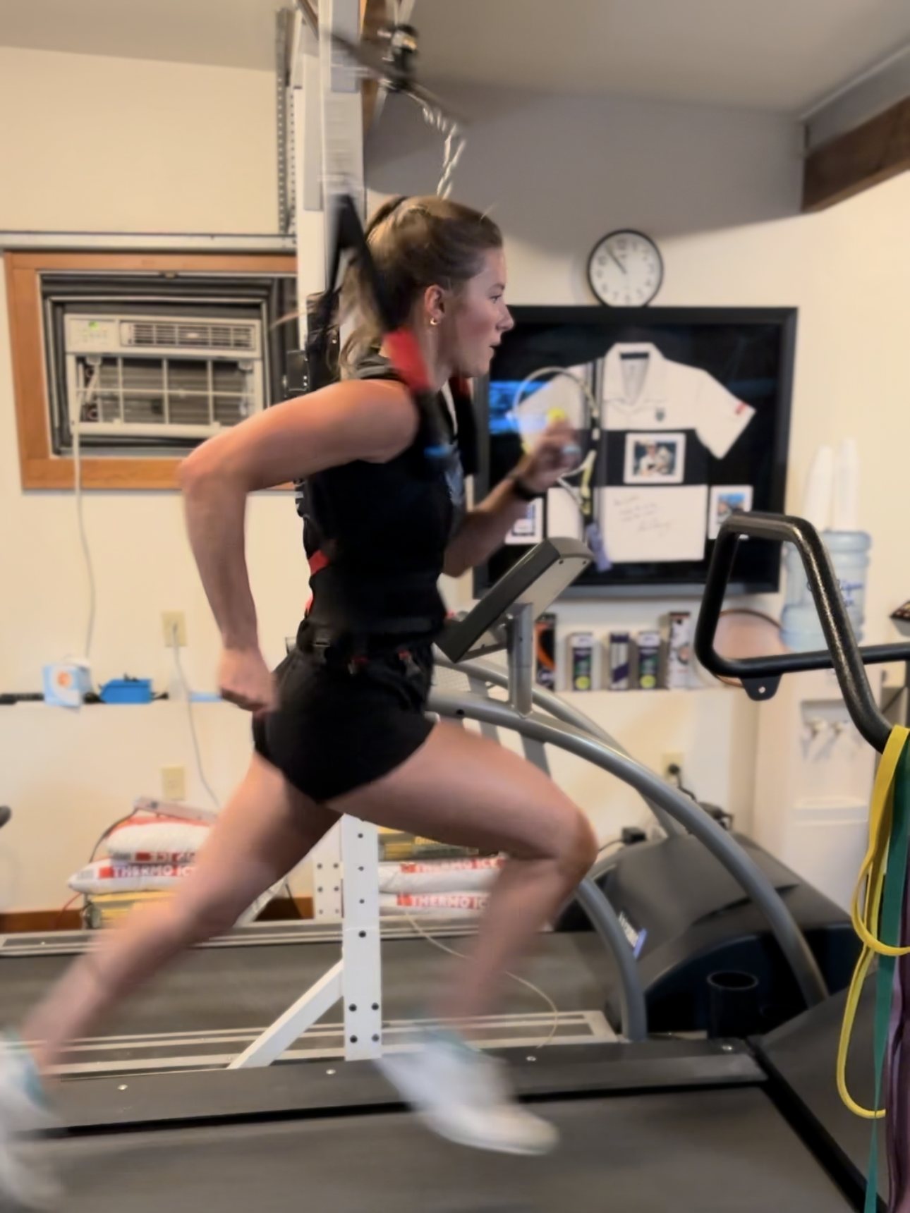 Athlete sprinting in a pneumatic harness on the high-speed treadmill at Electric Rehab and Fitness in Missoula